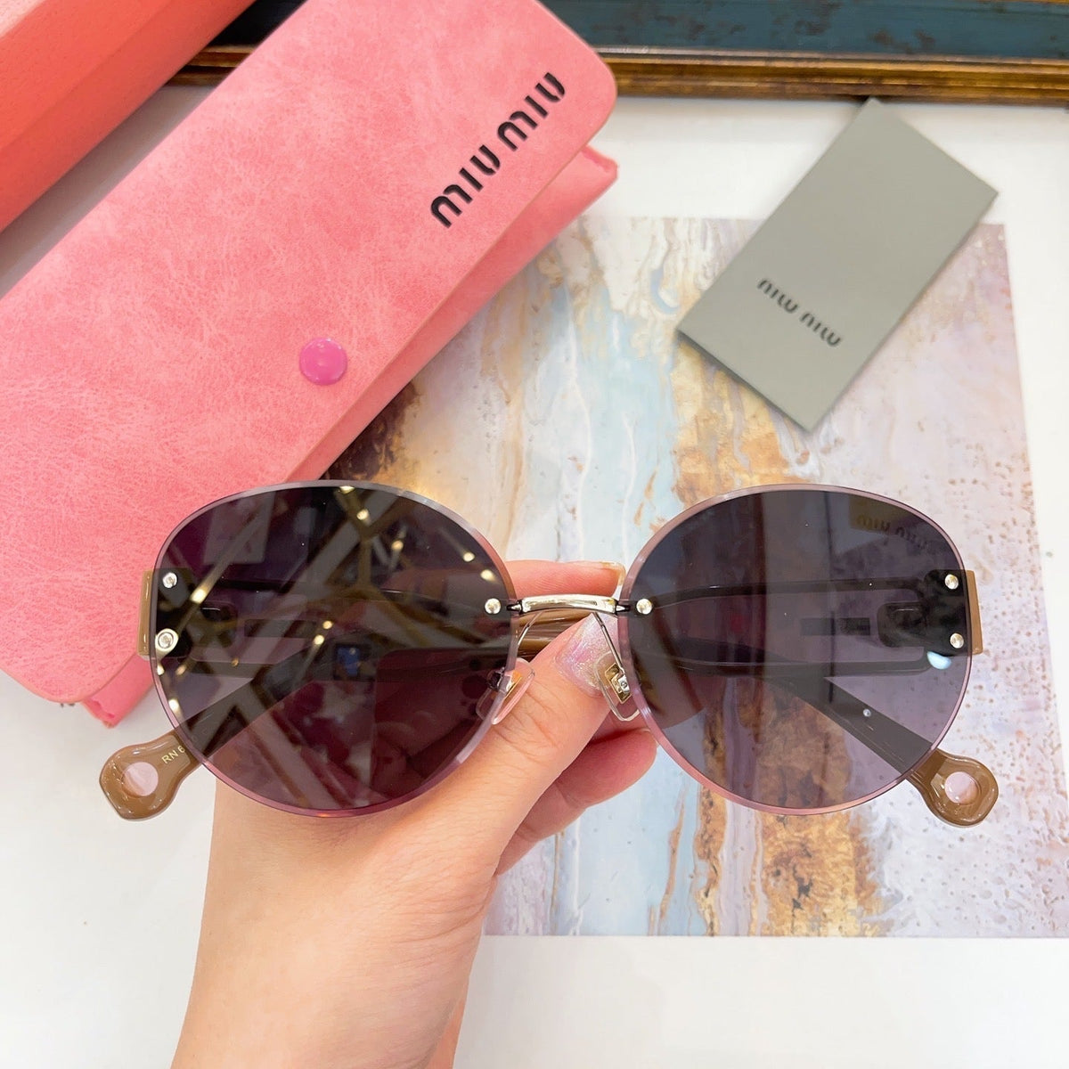 MIU M SUNGLASSES