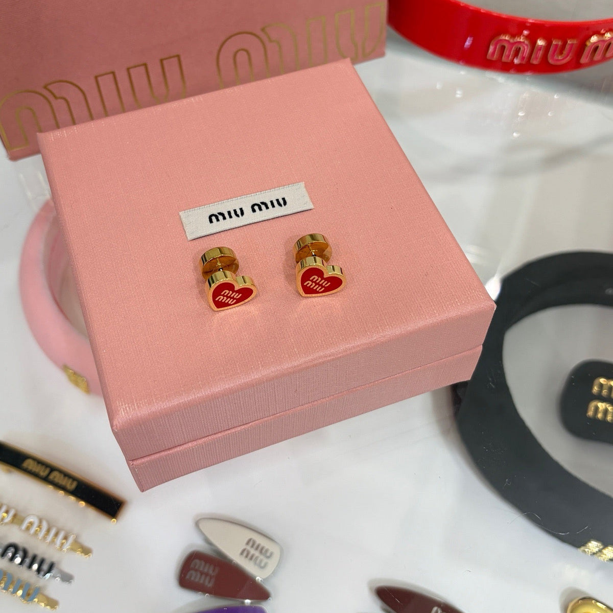 MIU M EARRINGS