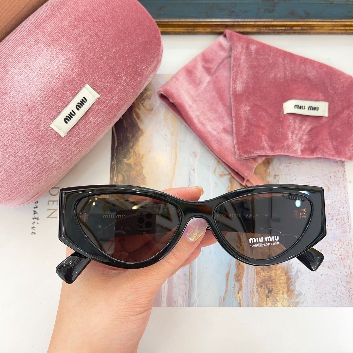 MIU M SUNGLASSES