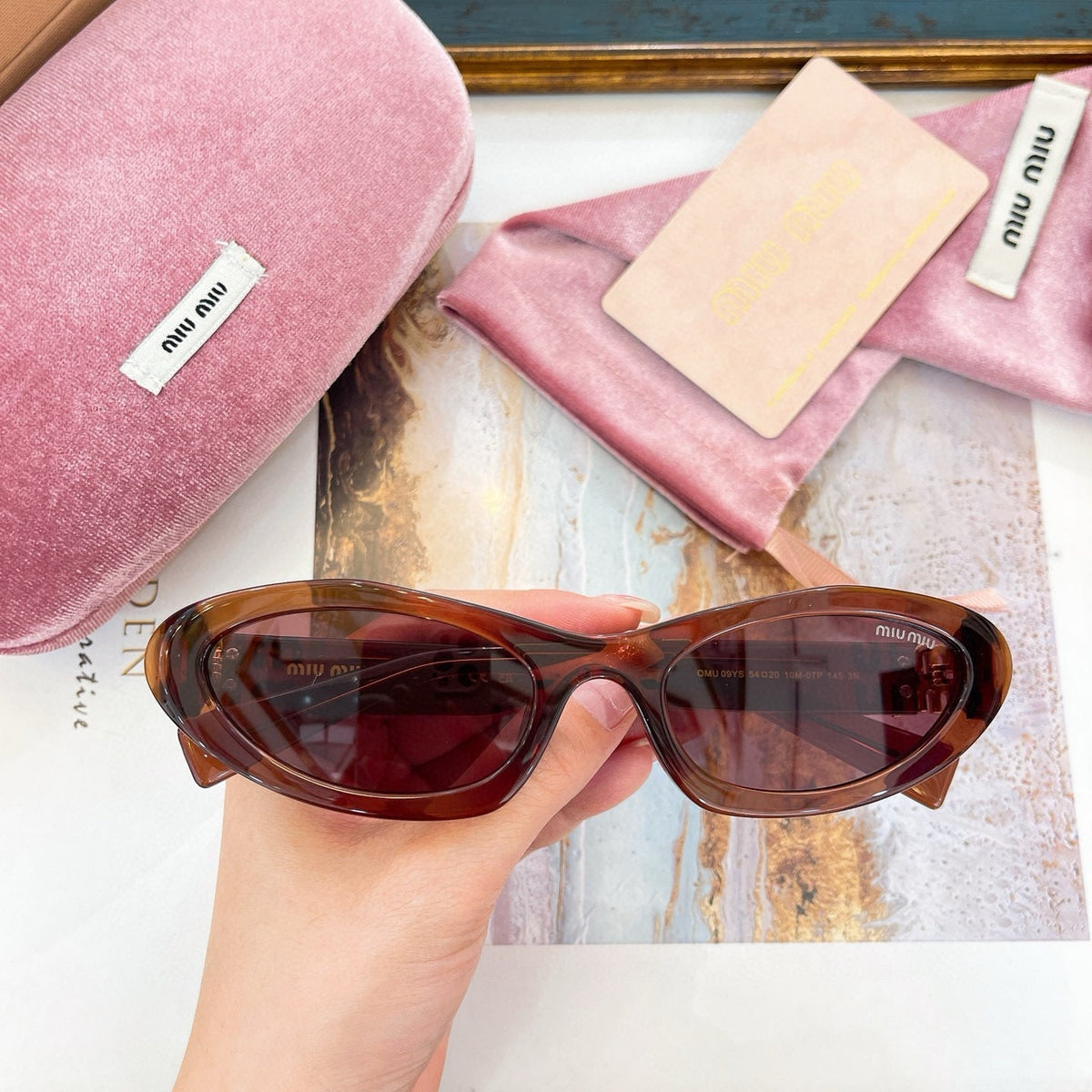 MIU M SUNGLASSES