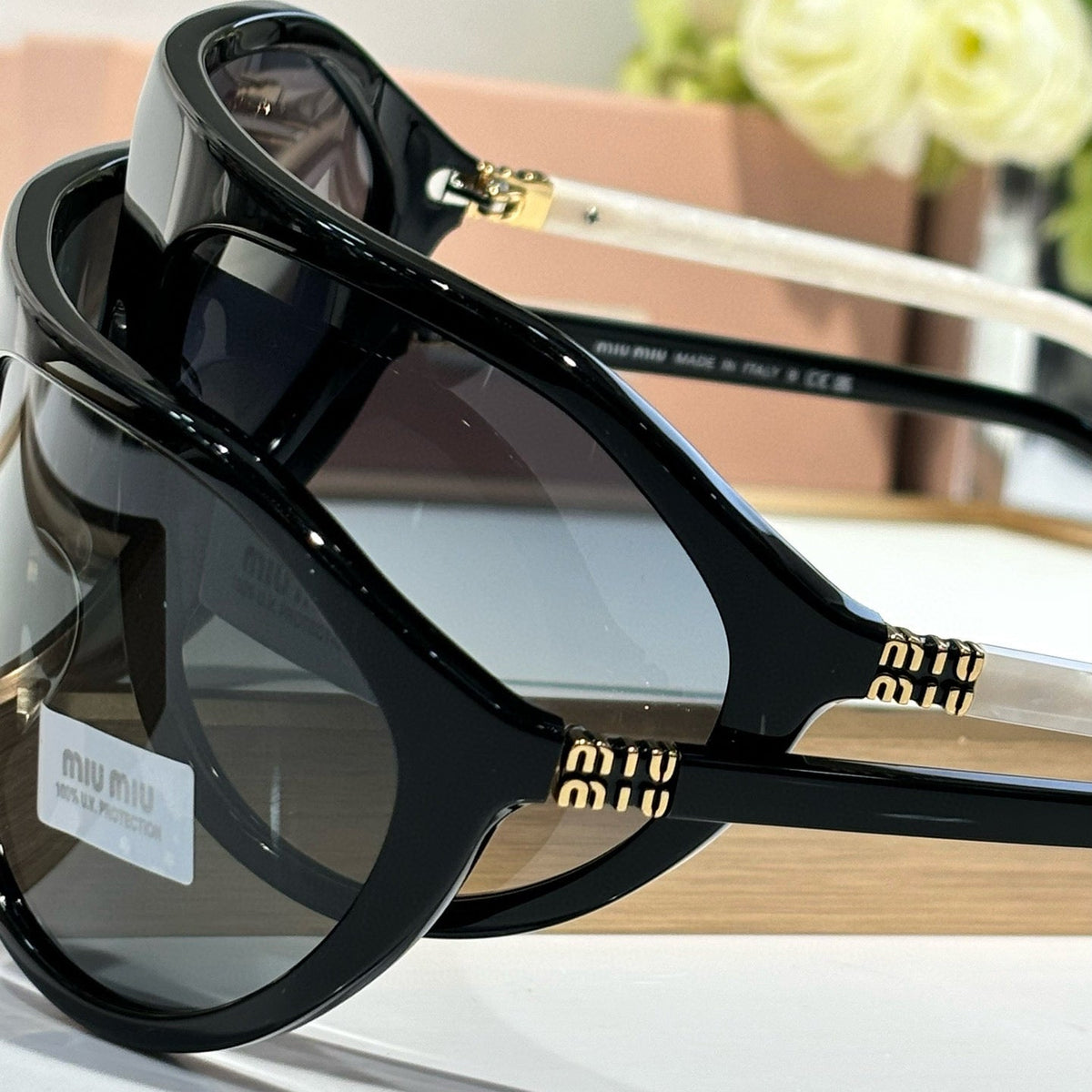 MIU M SUNGLASSES