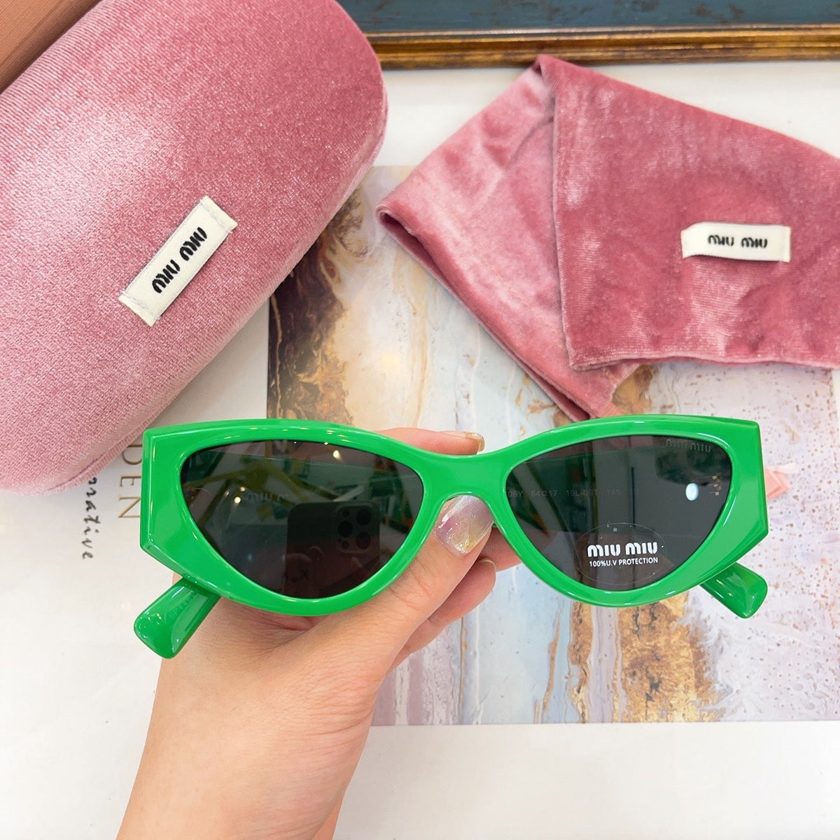 MIU M SUNGLASSES